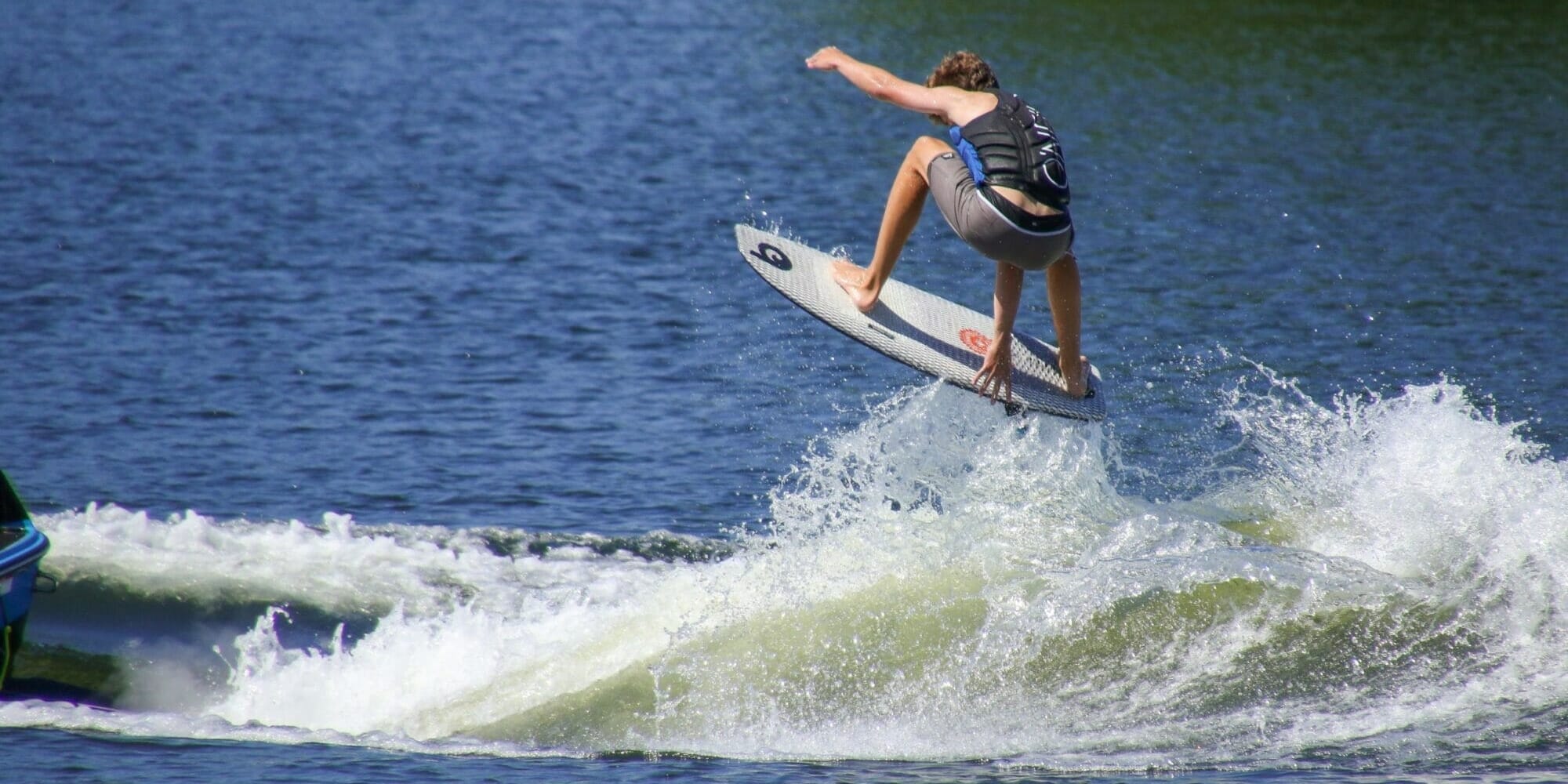 A man is riding a surfboard.