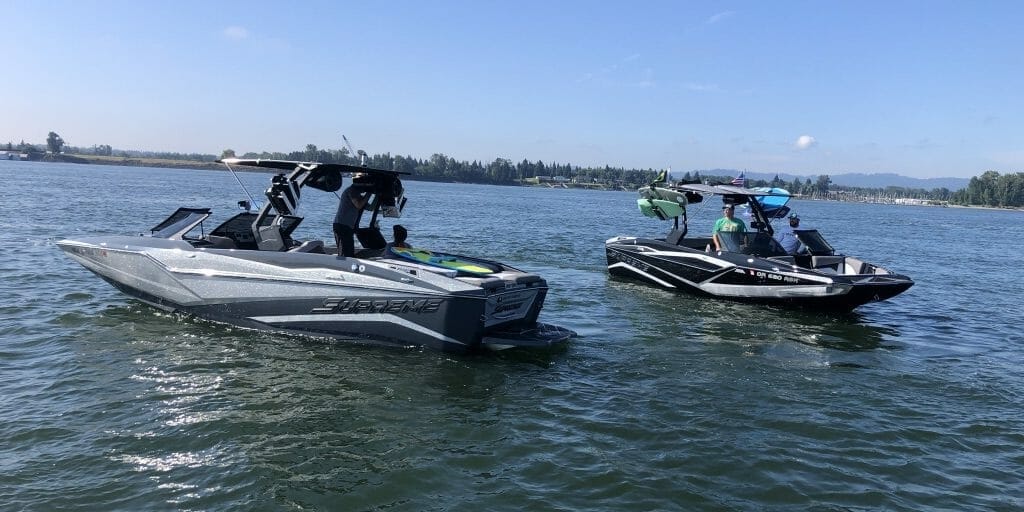Two Supreme boats on a body of water.