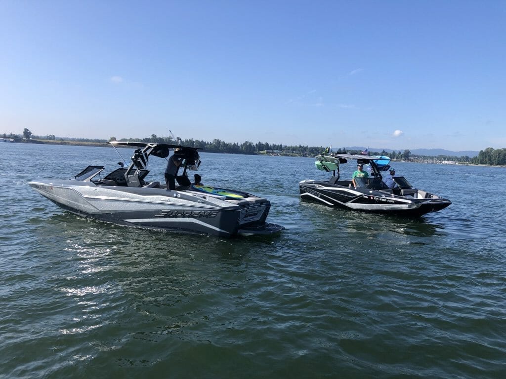 Two Supreme boats on a body of water.