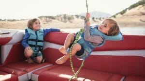 Two children playing in a Supreme boat