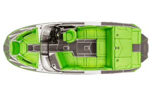 Top-down view of a sleek white and green Supreme Towboats S220 showcasing grey flooring, bright green padded seating, and a central control console with a steering wheel and instruments.