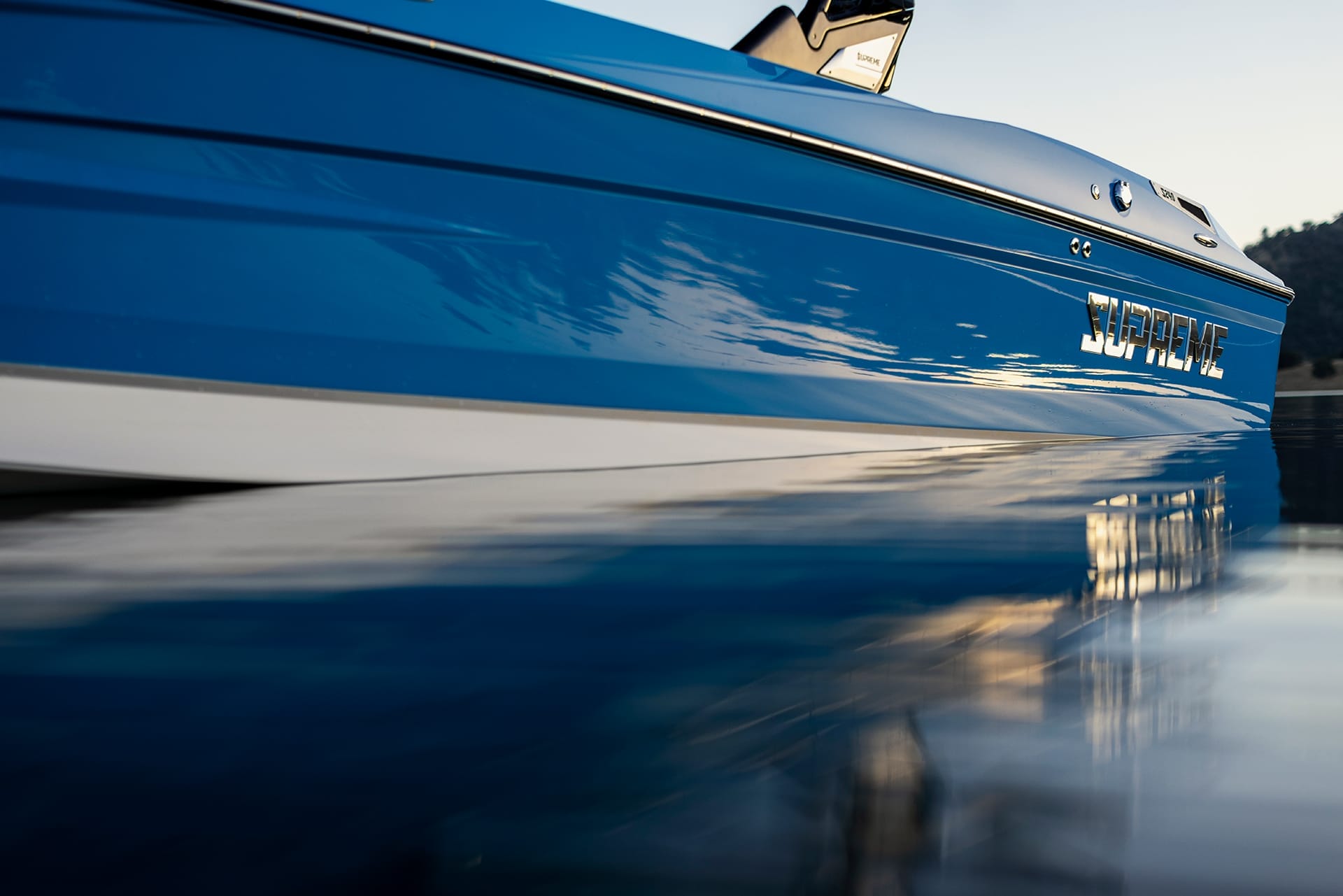 Close-up of a blue Supreme Boats S240 named 