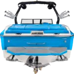 Image of the rear view of a blue and white motorboat with a seating area, wakeboard racks, and speakers mounted on the wakeboard tower from the 2024 Supreme Boat Models.