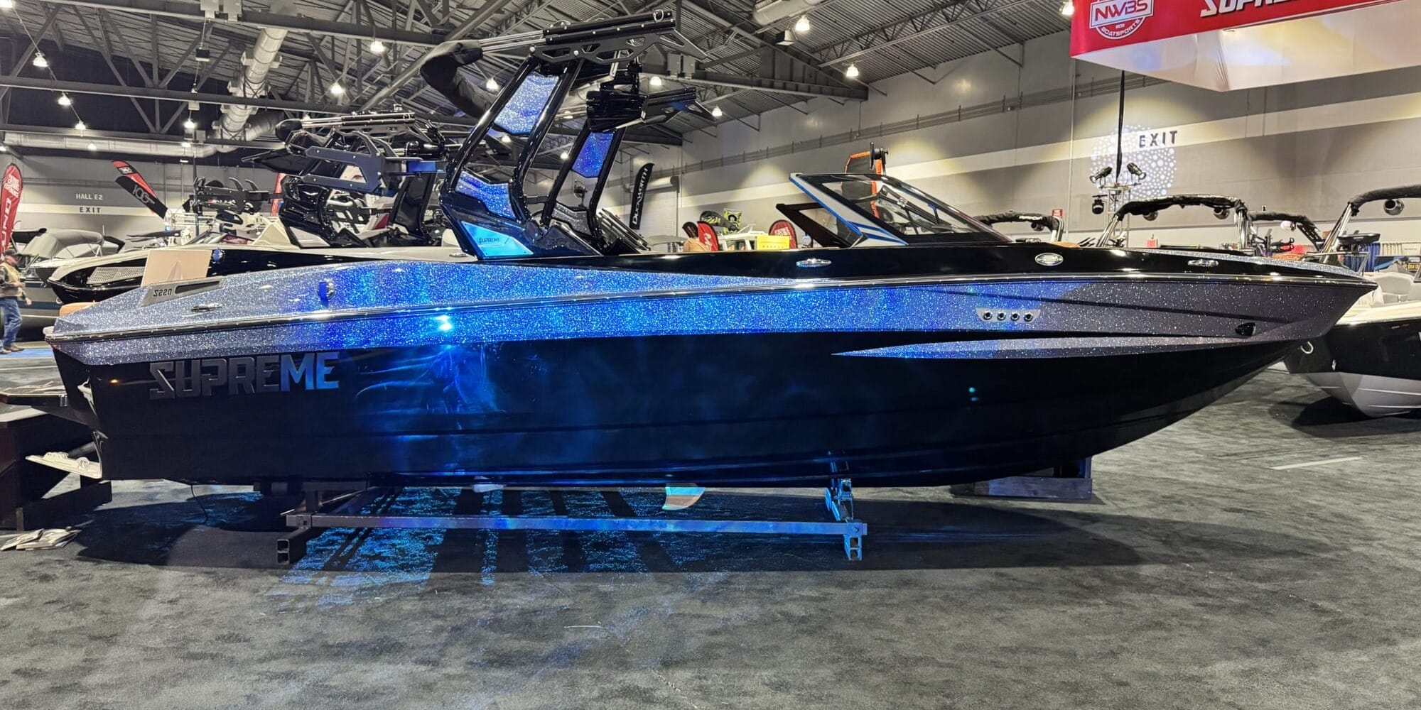 At the Portland Boat Show, a black and silver boat with 