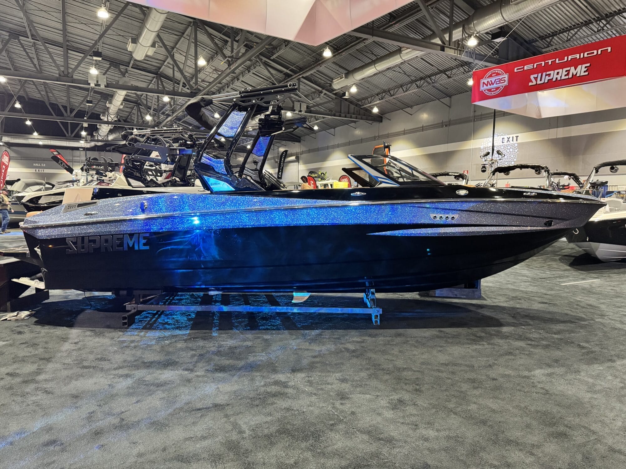 At the Portland Boat Show, a black and silver boat with 